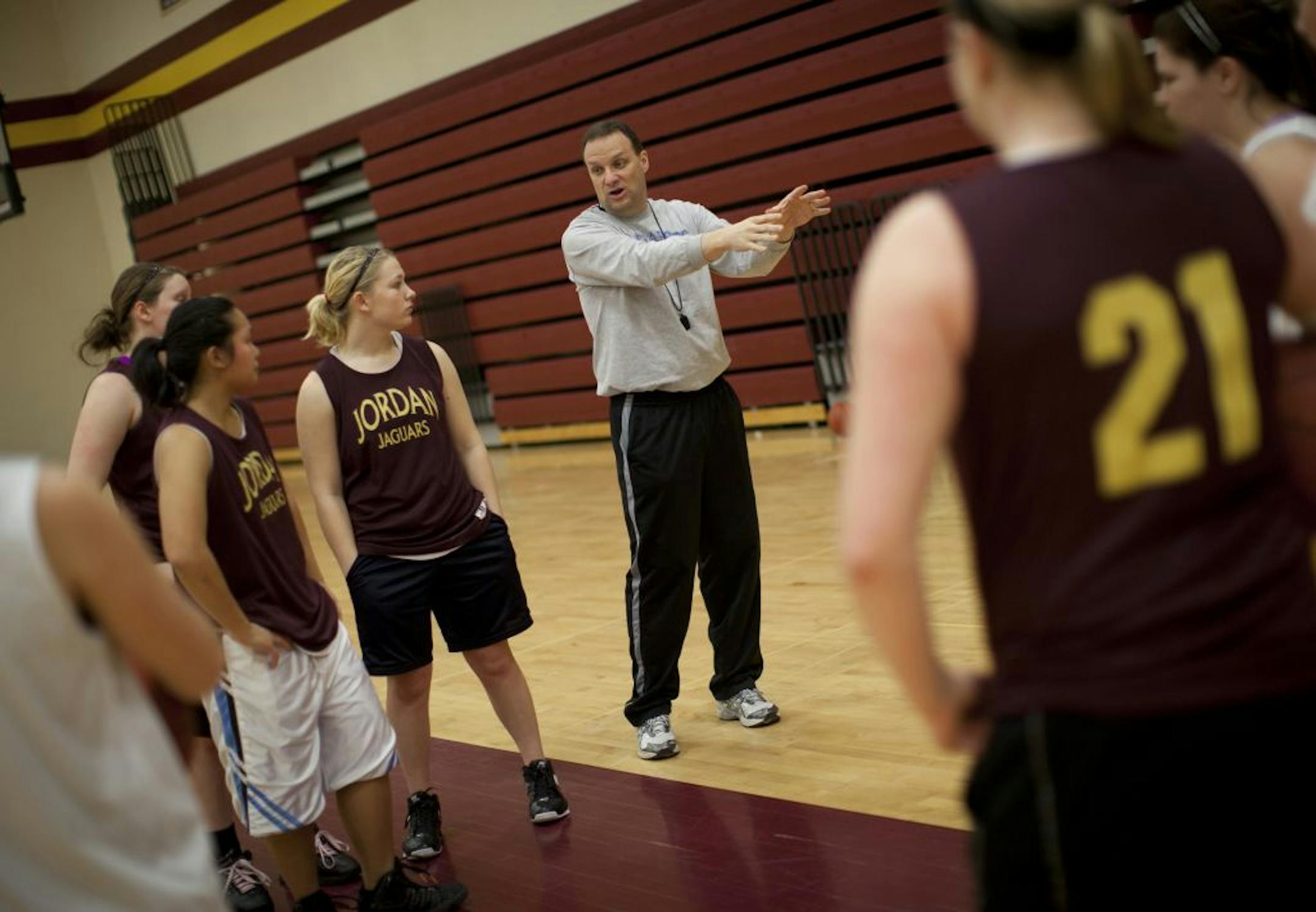 Girls' basketball head coach Greg Dietel talked with the team during a recent practice at Jordan High School. The former boys' team coach said he inherited a good situation when he took over coaching duties for the girls' team.