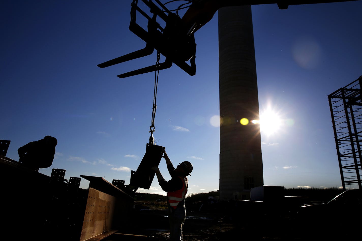 An iron worker in 2014 moves steel on the Essar Steel Minnesota's taconite mine project in Nashwauk, Minn. The company, now named Mesabi Metallic Co., is trying to jumpstart the project. (LEILA NAVIDI/leila.navidi@startribune.com)