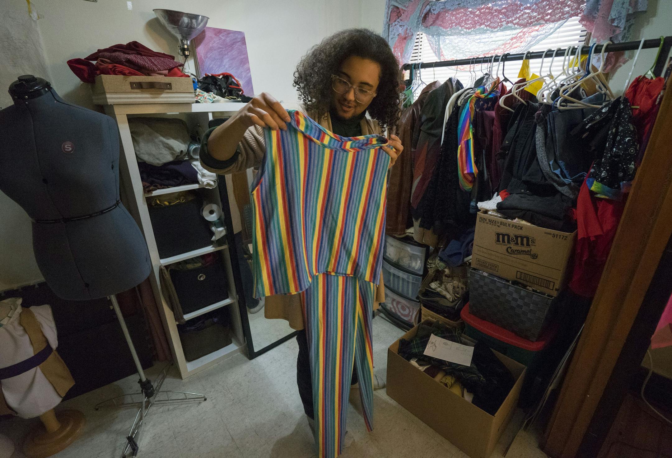 Mason Persons holds up a jumpsuit he made for the Pride festival.]
TONY SAUNDERS ¡ anthony.saunders@startribune.com on Monday, April 8, 2019 at his apartment in the Powderhorn neighborhood in Minneapolis.