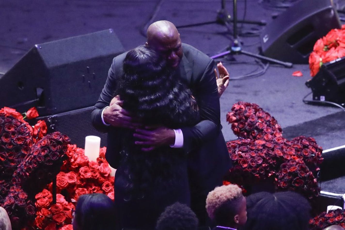 Former Los Angeles Lakers' Magic Johnson hugs Pam Bryant mother of Kobe Bryant during a celebration of life for Kobe Bryant and his daughter Gianna Monday, Feb. 24, 2020, in Los Angeles.