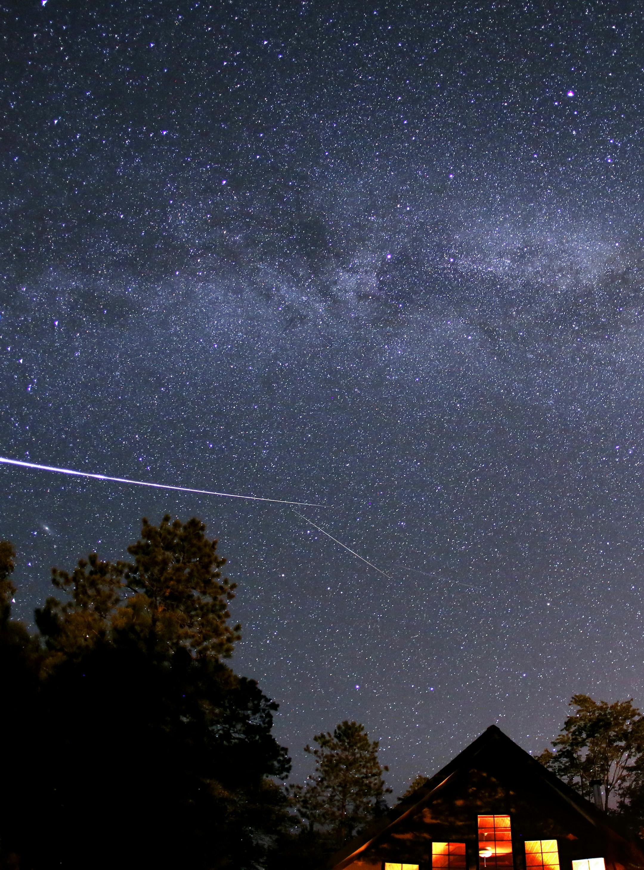 The annual Perseid meteor shower was expected to peak Monday morning between 3 and 5 a.m. and was visible in Northern Minnesota. This shot, taken Sunday morning near Cotton, MN shows a couple meteors along with the Milky Way at about 12:30 AM. The shower happens as Earth passes through a stream of debris from the comet Swift-Tuttle. If you live in North America, stargazers should be able to spot the shooting stars any time after dark, with NASA predicting up to 100 meteors per hour. ] (NOT FOR R