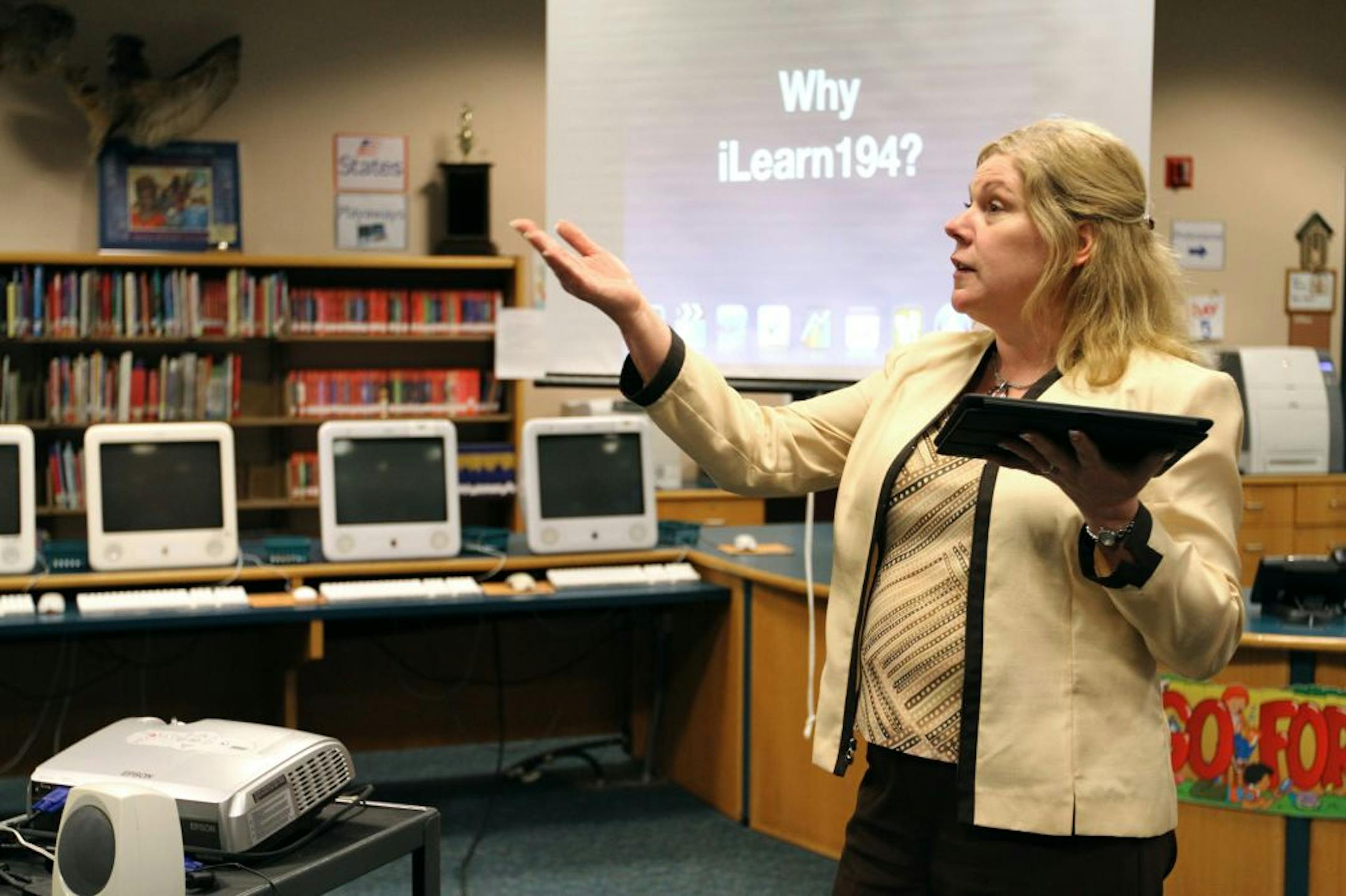 Superintendent for Lakeville Area Public Schools Lisa Snyder delivered an informational presentation to parents using a wireless iPad about integrating iPads into student learning.