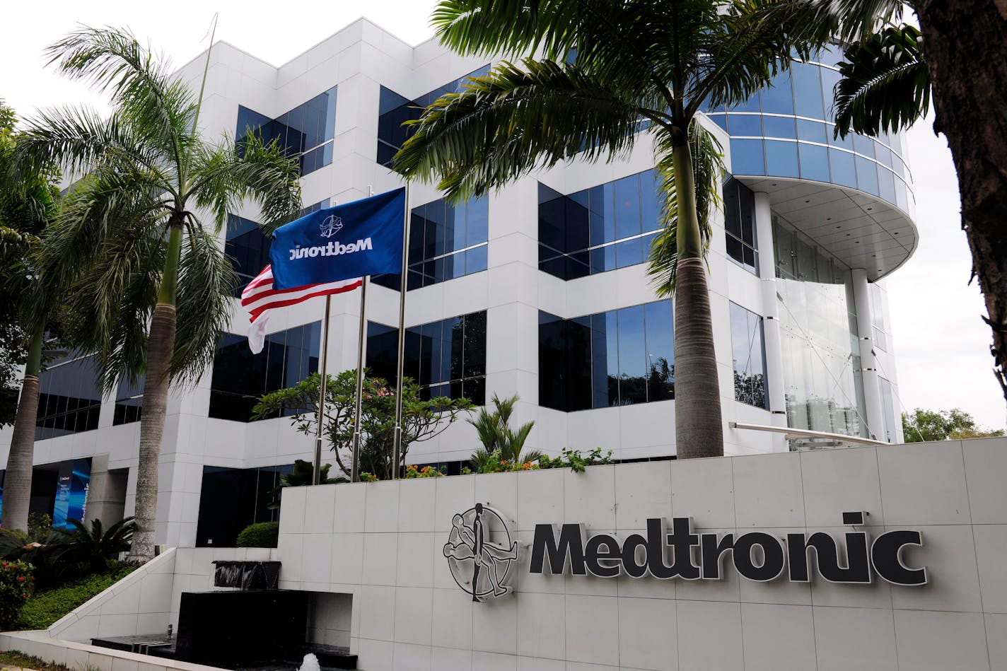 The logo of Medtronic Inc. is displayed at Medtronic Singapore Operations (MSO), the company's new manufacturing facility in Singapore, on Thursday, March 10, 2011. Medtronic, the world's largest maker of heart devices, plans to hire about 600 people in India and China as it seeks to double the sales contribution from emerging markets within five years. Photographer: Munshi Ahmed/Bloomberg