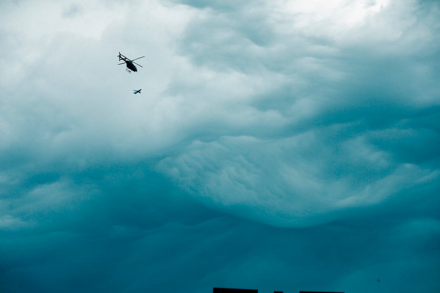 A State Patrol helicopter flies over the air space near Mystic Lake and Little Six Casino's looking for murder suspect Ty Hoffman, Wednesday, Sept. 3 , 2014 in Prior Lake, Minn. Hoffman is accused of fatally shooting a business and romantic partner, Kelly Phillips, on Aug. 11 at an Arden Hills gas station. (AP Photo/The Star Tribune, Jerry Holt) ST. PAUL PIONEER PRESS OUT, MINNEAPOLIS-AREA TV OUT, MAGS OUT