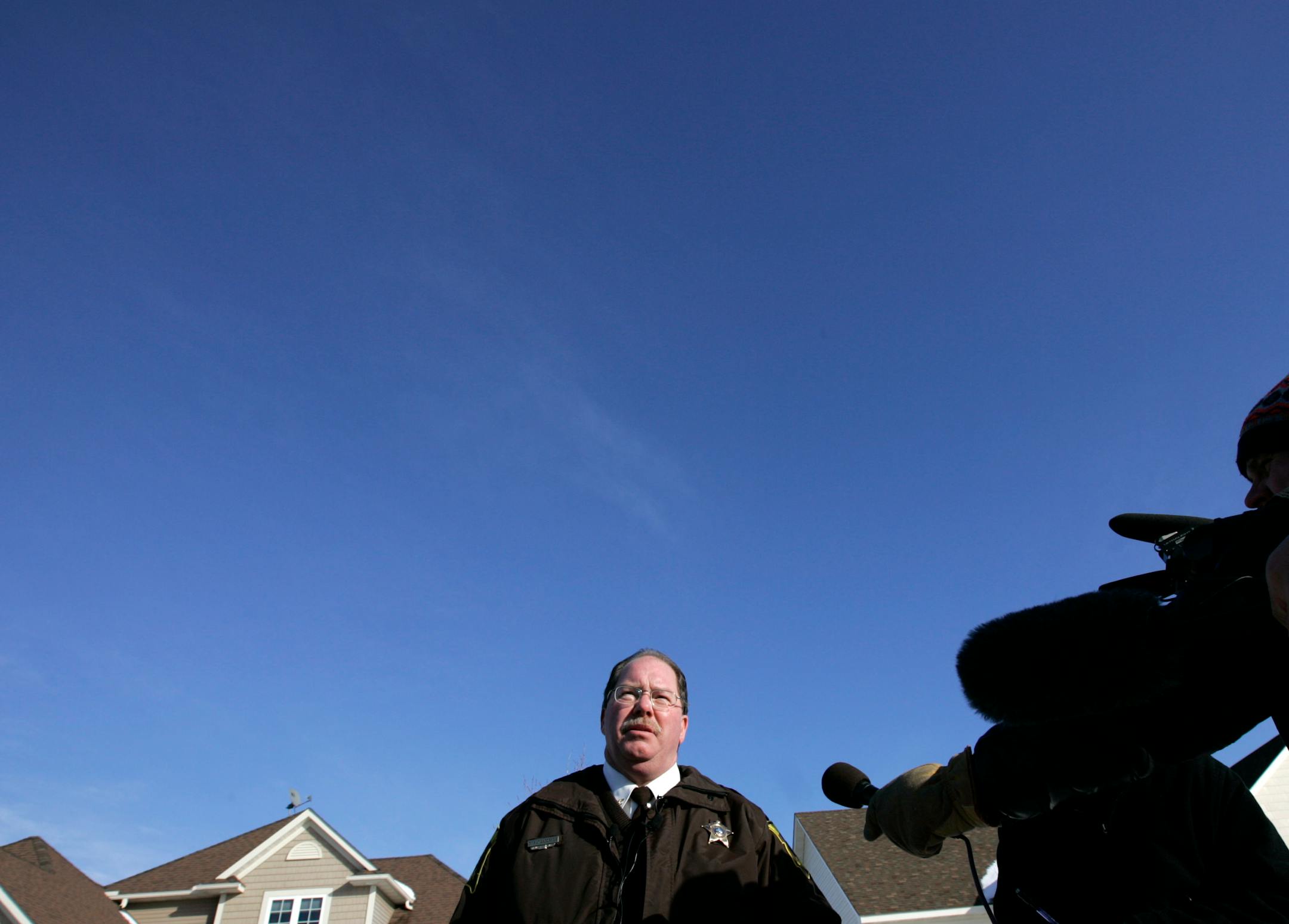 Ramsey County Undersheriff George Altendorfer spoke to reporters about the bust outside the house. He said it was one of the largest marijuana-growing operations in the county's history.