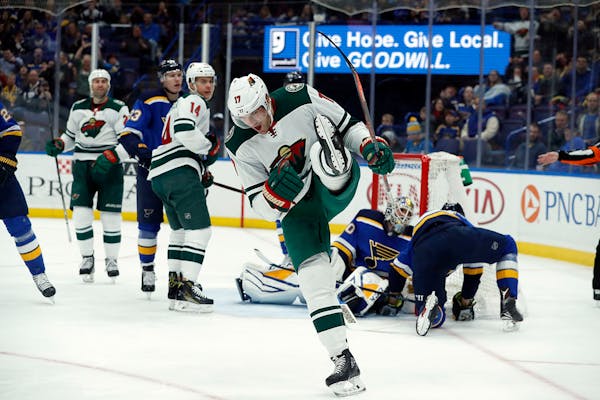 Minnesota Wild's Marcus Foligno celebrates after scoring during the first period of an NHL hockey game against the St. Louis Blues Tuesday, Feb. 6, 20