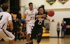 Jarvis Johnson (12) passed to a teammate in the first half of DeLaSalle's game against Fridley last season.