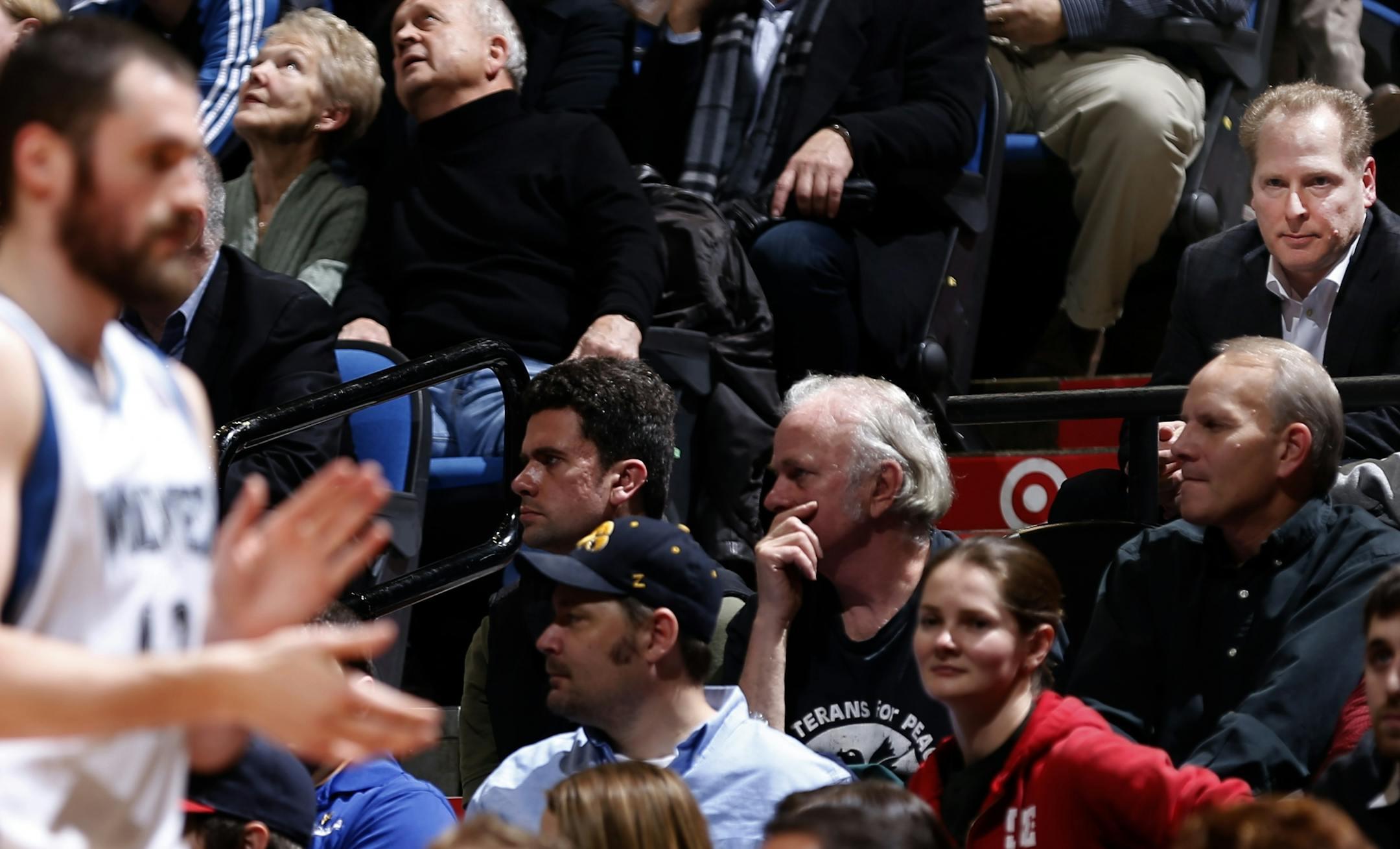 Wolves president of basketball operations David Kahn, upper right, watched Kevin Love walk off the court during a substitution in the fourth quarter.