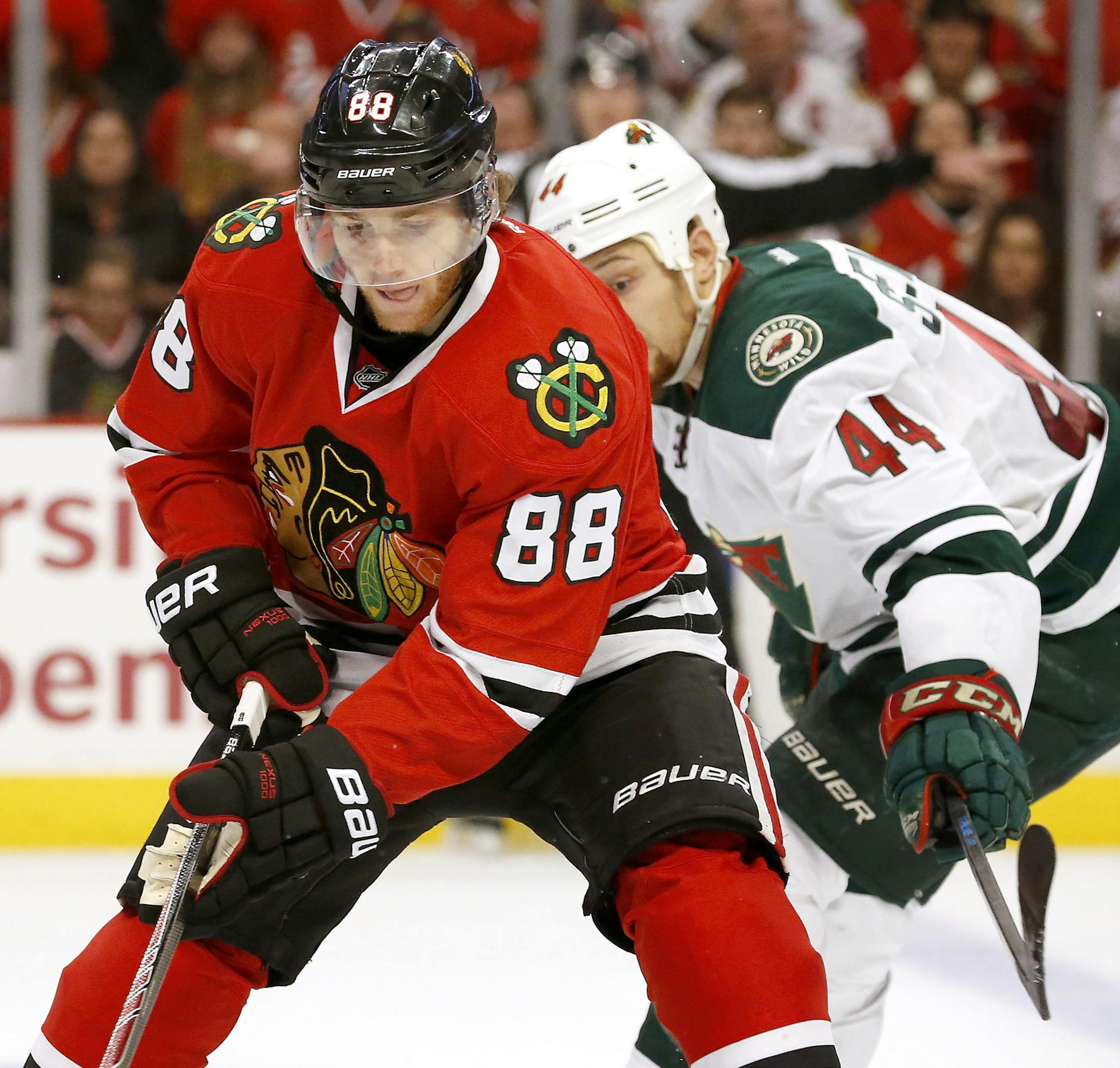 Patrick Kane (88) and Chris Stewart (44) fought for the puck in the second period. ] CARLOS GONZALEZ cgonzalez@startribune.com, May 1, 2015, Chicago, IL, United Center, NHL, Minnesota Wild vs. Chicago Blackhawks, Game 1, Stanley Cup Playoffs, Round 2