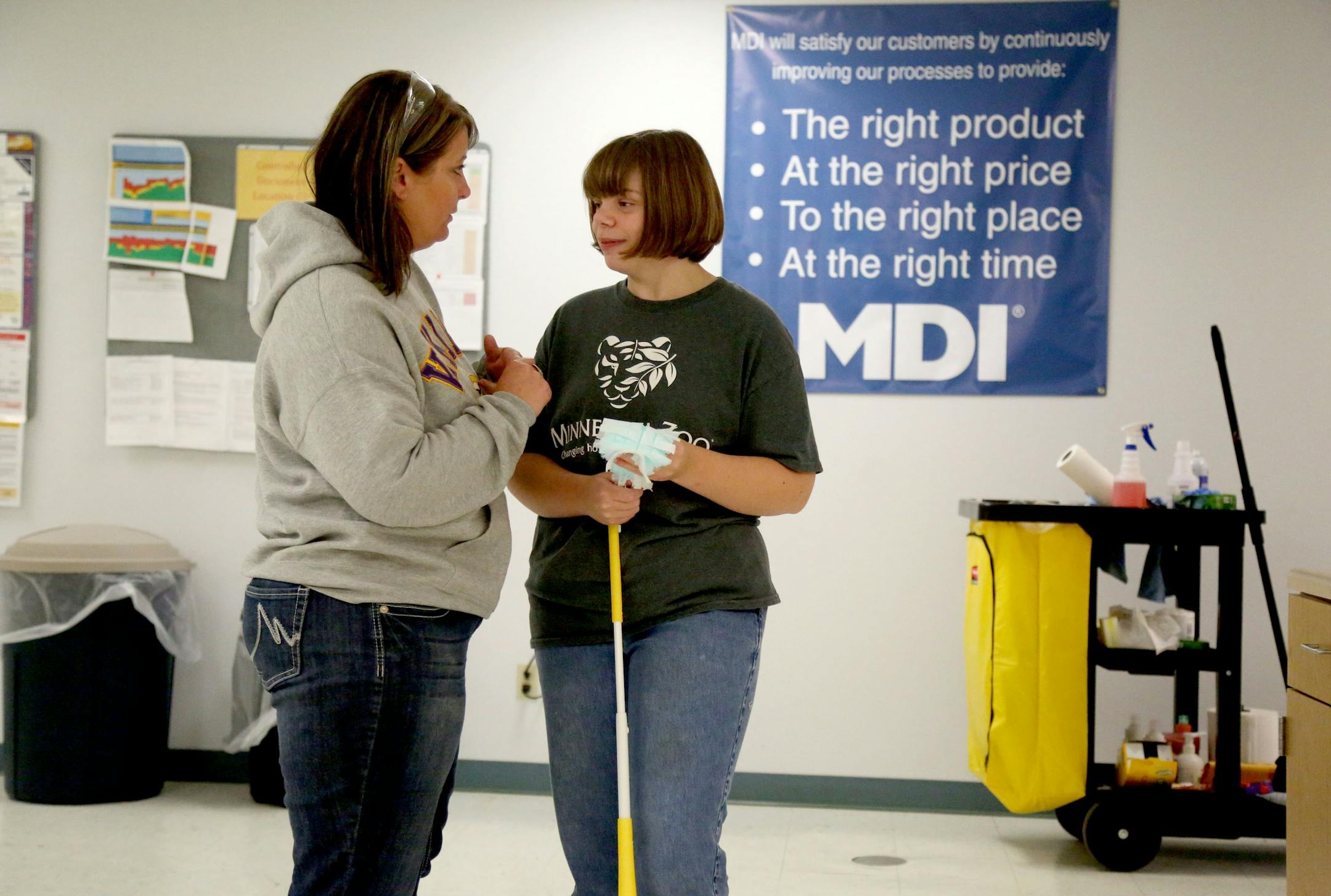 Disabled workers like John Week, 37, have opportunities that they never thought possible. Workers who once toiled for years in dead-end jobs are now making up to $14 an hour at an MDI facility and have opportunities for advancement. Breanna Terwey, 23, chatted with fellow employee Kelli Petersen while cleaning the break room at MDI�s recycling plant Tuesday, Sept. 27, 2016, in Cohasset, MN.