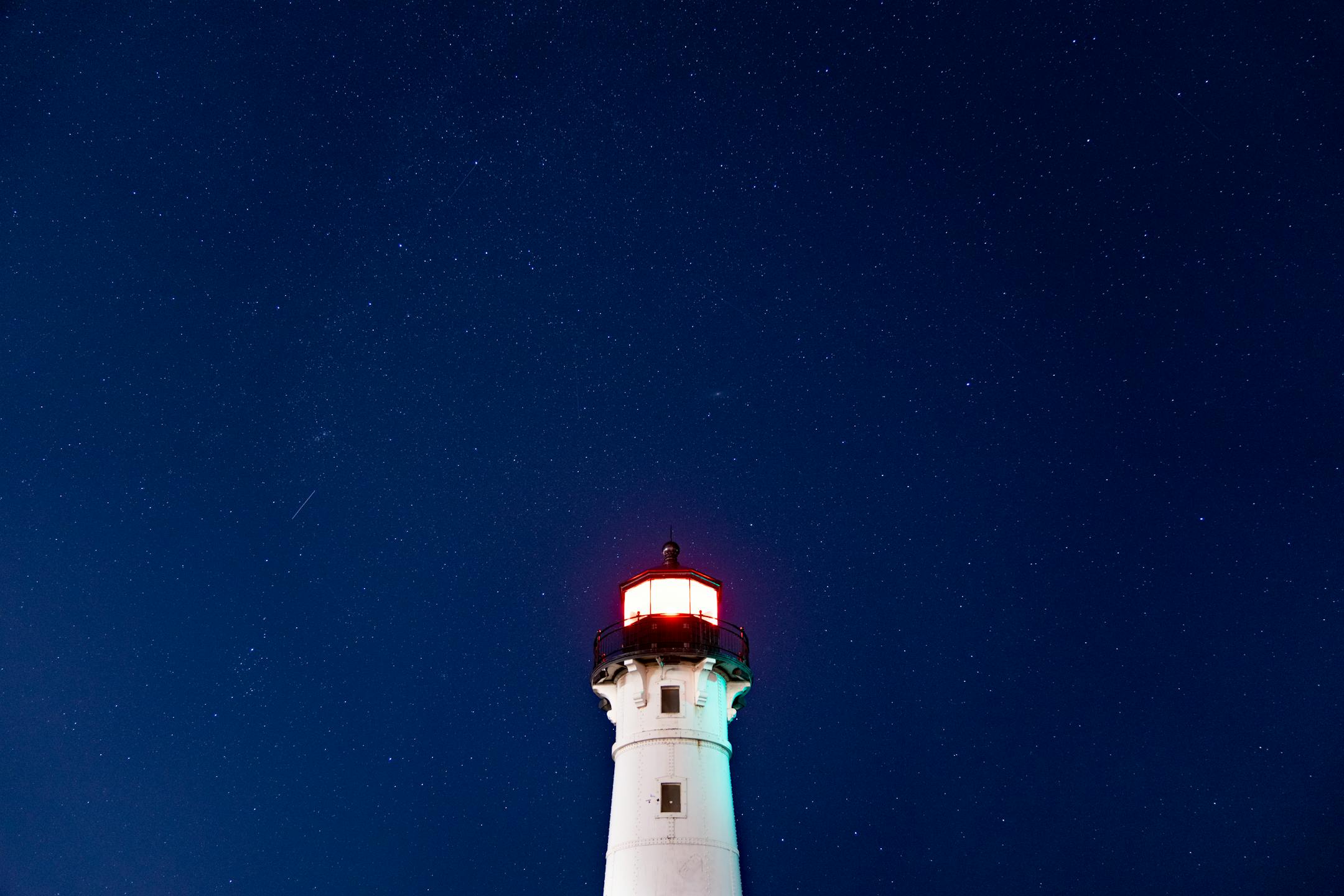 Faint stars are visible over the Duluth Harbor North Breakwater Lighthouse despite light pollution Tuesday, Sep. 27, 2022 in Duluth, Minn.   ]