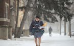 Mel Peterson delivered mail along his route in January 2018 on Park Avenue in Minneapolis. "I'm comfortable as long as I keep moving," he said. "At wo