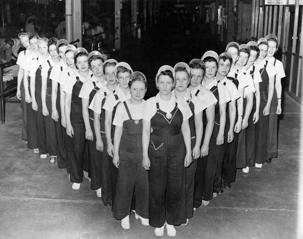 Female employees of the Twin Cities Ordnance Plant, later known as Twin Cities Army Ammunition Plant, posed for a photo during World War II.