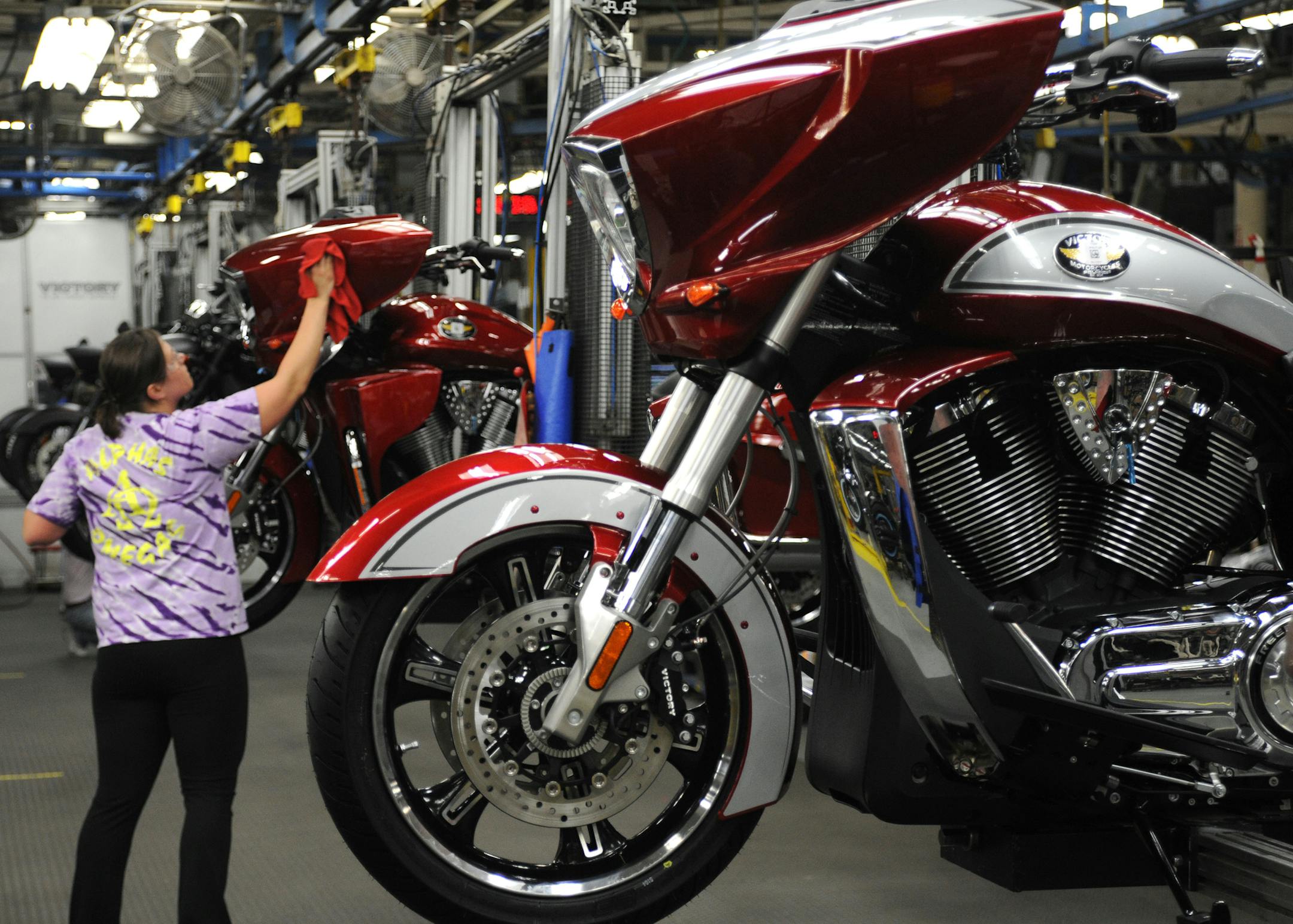 Long known for its snowmobiles and atvs, Polaris is attempting to become a bigger player in motorcycle manufacturing. Last year it added the iconic Indian brand to its line up of cruisers and touring bikes produced under the Victory name. A worker buffed the finish of a Victory motorcycle on the assembly line in Spirit Lake Iowa.] Richard.Sennott@startribune.com Richard Sennott/Star Tribune. , Spirit Lake IA. Monday 02/13/12) ** (cq)
