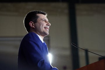 Pete Buttigieg smiles as he is cheered by supporters at a primary night gathering in Nashua, N.H., on Tuesday, Feb. 11, 2020. Buttigieg finished secon