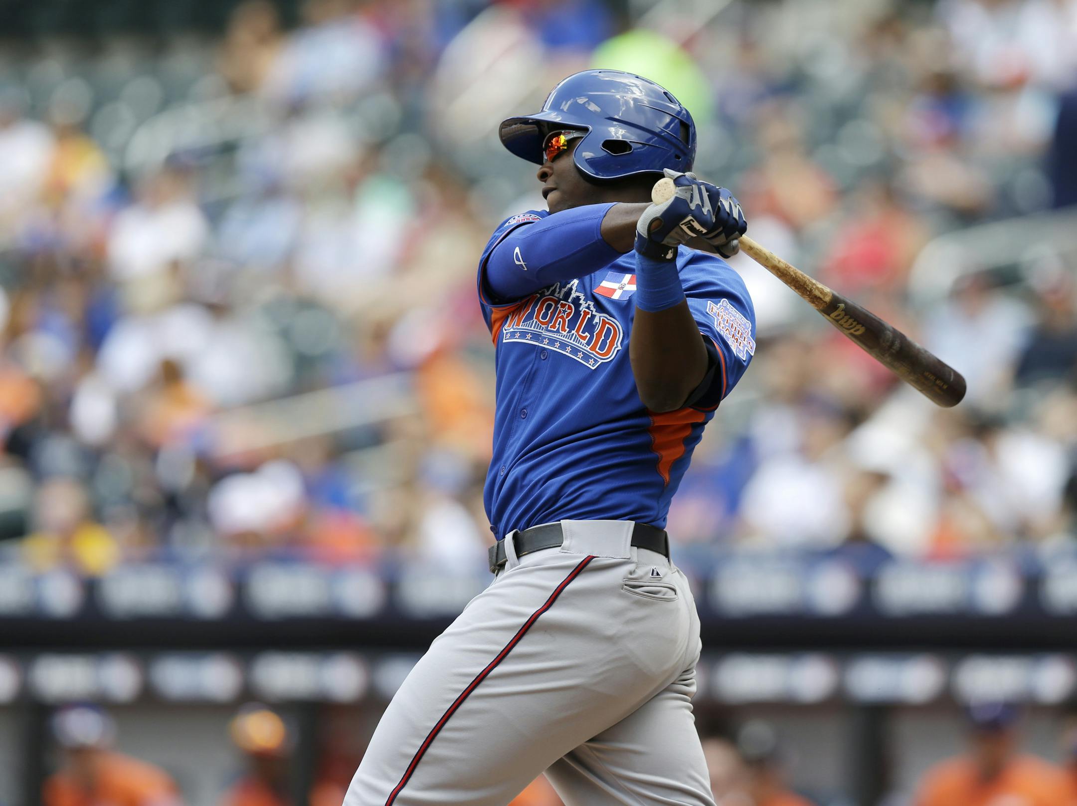 World's Miguel Sano grounds out in the second inning of the All-Star Futures baseball game against the United States on Sunday, July 14, 2013, in New York. (AP Photo/Kathy Willens) ORG XMIT: MIN2013072619364974