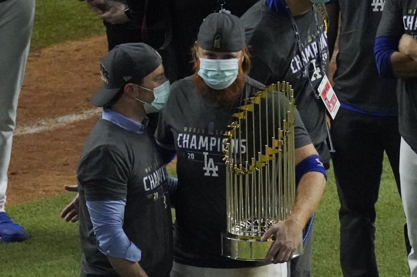 Los Angeles Dodgers third baseman Justin Turner celebrates with the trophy after defeating the Tampa Bay Rays 3-1 to win the baseball World Series in Game 6 Tuesday, Oct. 27, 2020, in Arlington, Texas.