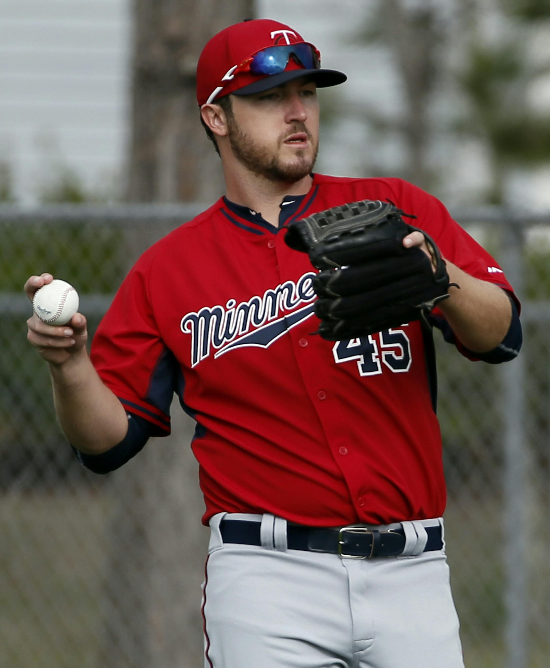Minnesota Twins' Phil Hughes throws as he warms up before a workout at baseball spring training in Fort Myers Fla., Tuesday Feb. 24, 2015. (AP Photo/Tony Gutierrez) ORG XMIT: MIN2015032522041075