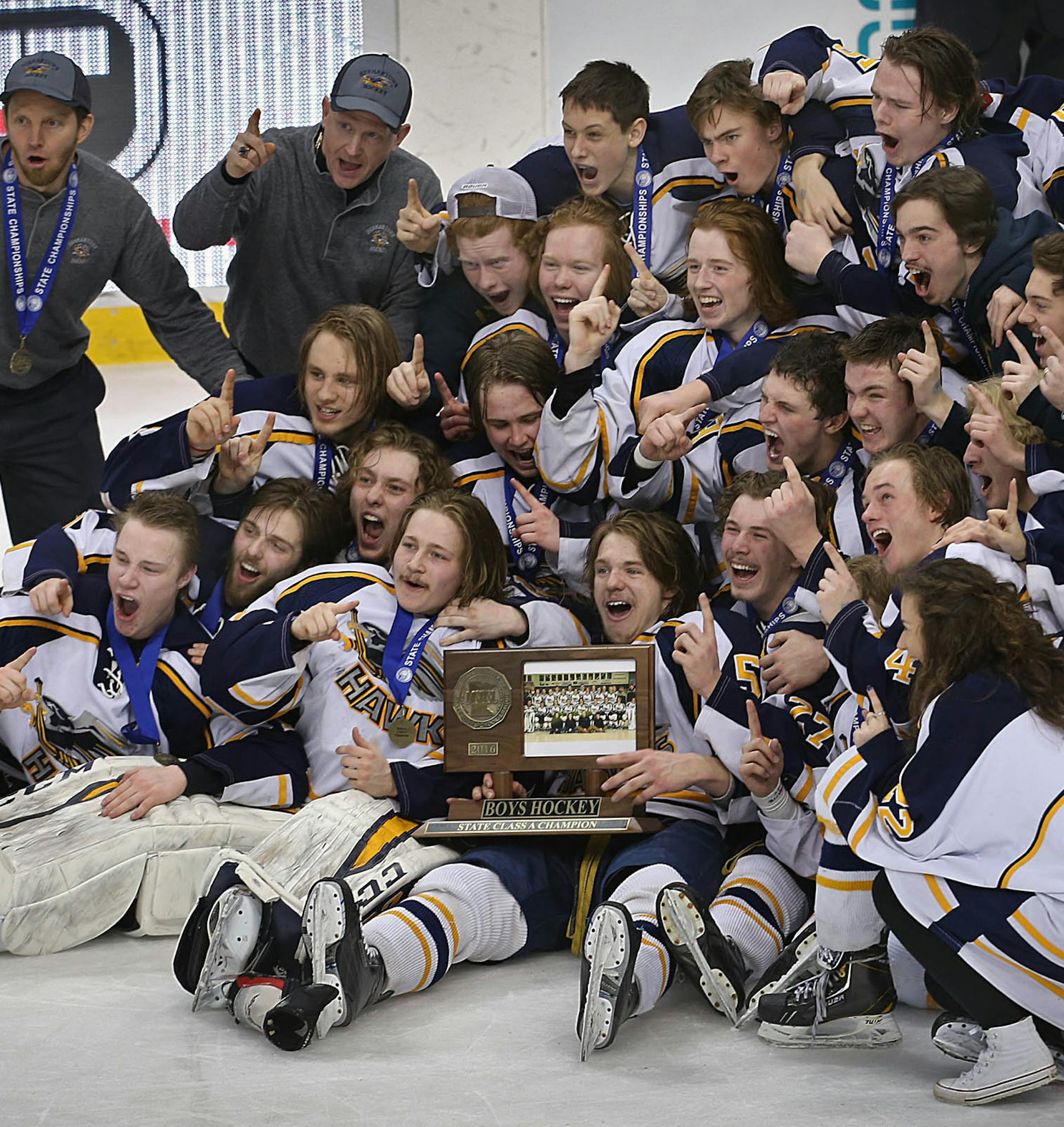 Hermantown players posed for photographs with their championship trophy. ] JIM GEHRZ ï james.gehrz@startribune.com / St. Paul, MN / March 5, 2016 /12:00 PM ñ BACKGROUND INFORMATION: Breck School played Hermantown High School in the Class 1A championship game at the Xcel Energy Center at the 2016 Boysí State Hockey Tournament.