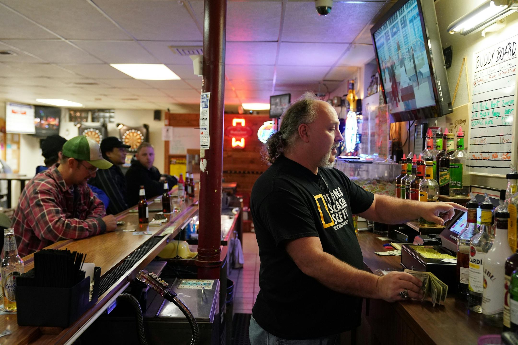 Bartender and and the National Polish Alliance outpost president Lonnie Finke rang up regulars during a quiet Thursday night.