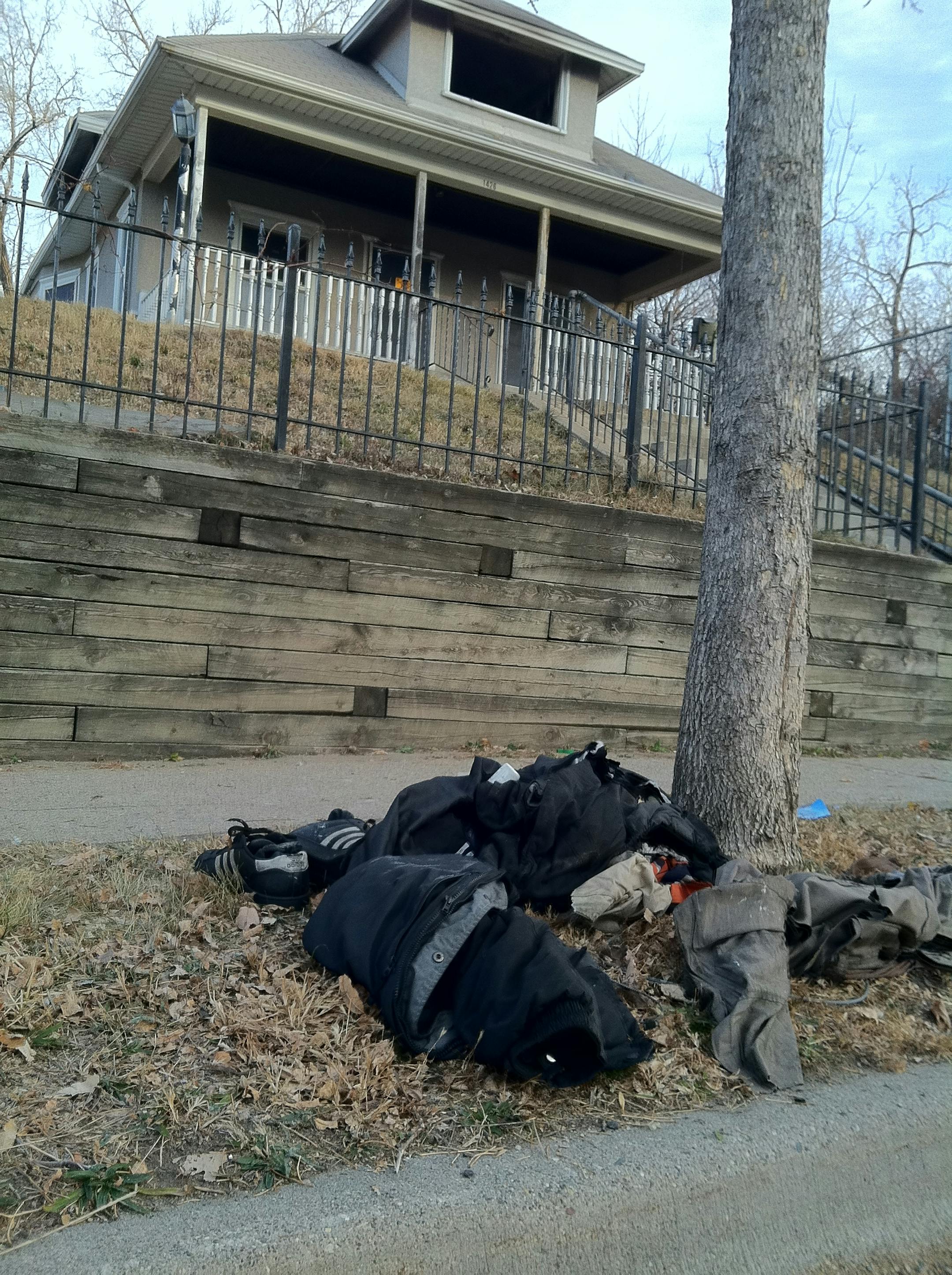 A pile of clothes was on the ground in front of an apparently abandoned house at 1426 Barnes Place in Minneapolis, where a man reportedly died in a fire Wednesday morning.