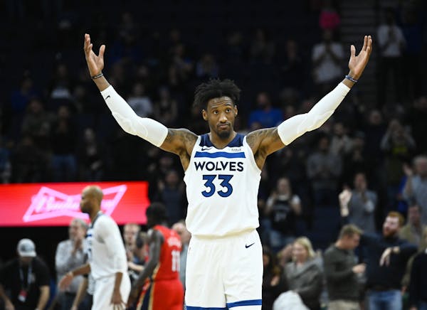 Minnesota Timberwolves forward Robert Covington (33) celebrated his team's 107-100 win against the New Orleans Pelicans Wednesday night.