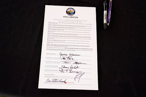 A signed copy of a declaration commemorating the restoration of more than 28,000 acres of Bois Forte reservation land during a ceremony Tuesday, June 7, 2022 in Nett Lake, Minn. ]