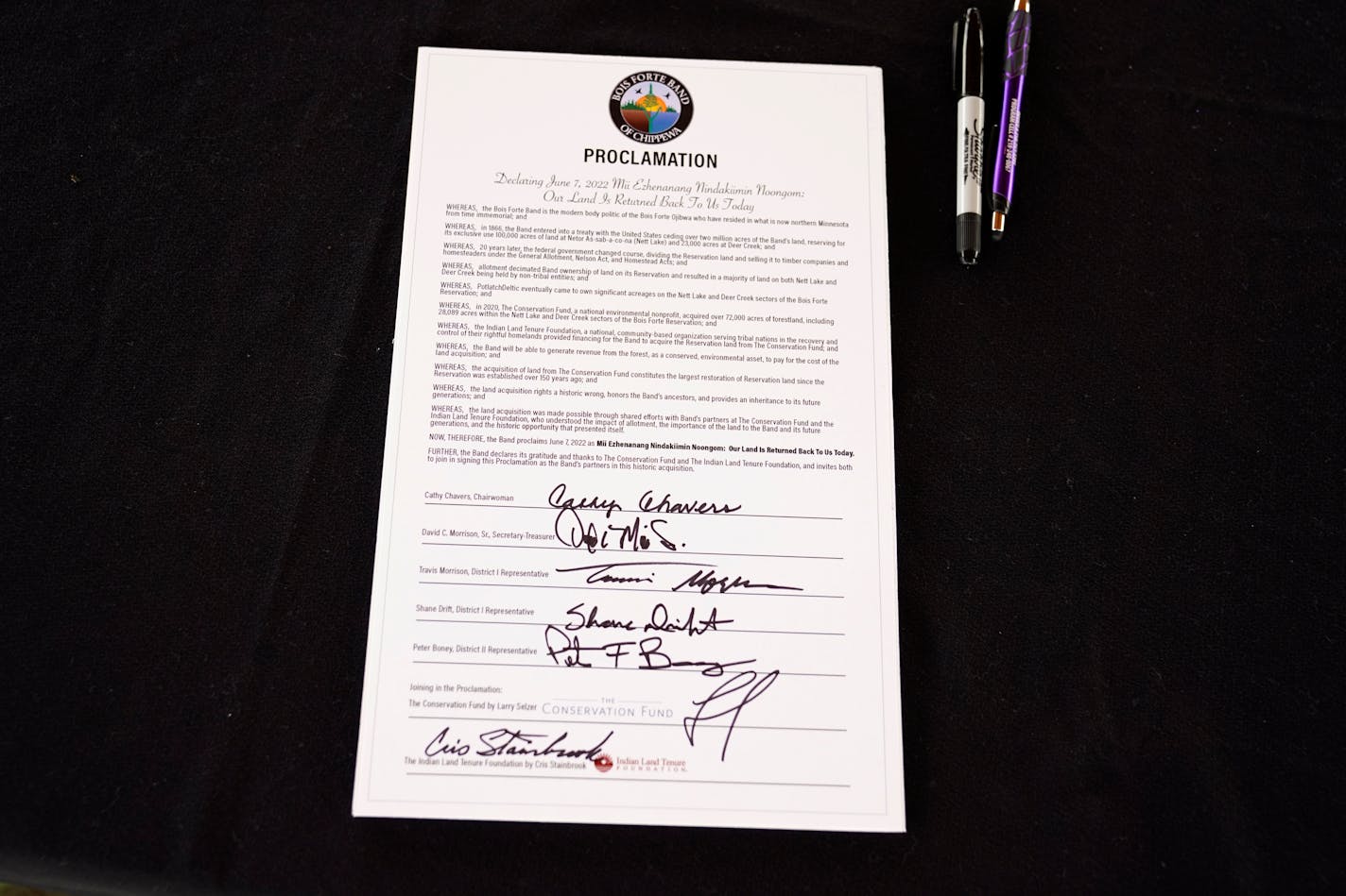 A signed copy of a declaration commemorating the restoration of more than 28,000 acres of Bois Forte reservation land during a ceremony Tuesday, June 7, 2022 in Nett Lake, Minn. ]