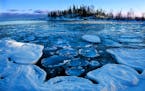 As Lake Superior struggled to freeze over, pancake ice developed in the bay near Cove Point. Researchers say Lake Superior is warming even faster than