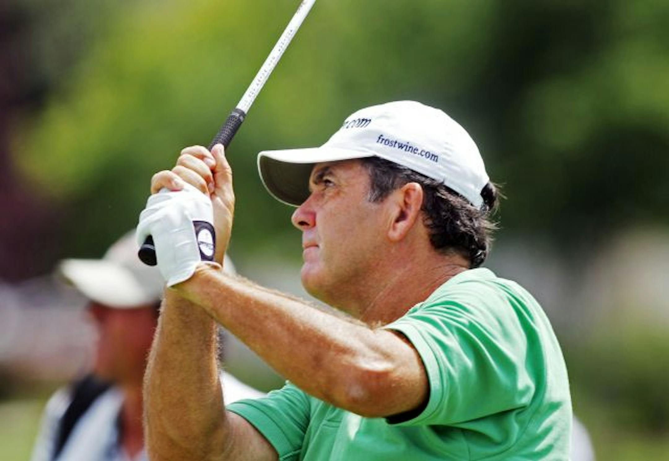 David Frost watches his tee shot on hole number two. Frost ended the day at 14 under par, tied for the lead with Mark Cacavecchia.