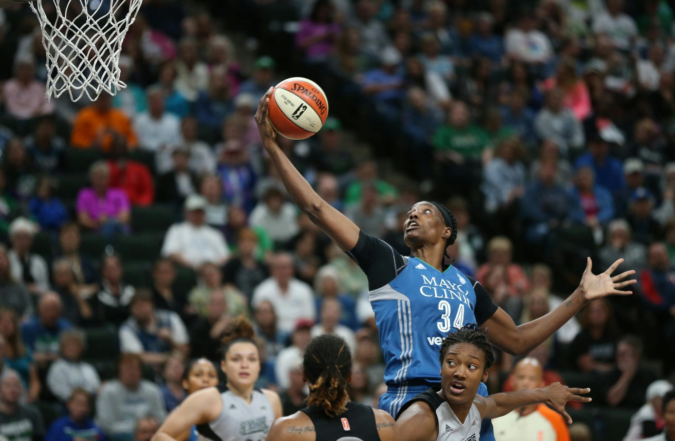 Minnesota Lynx center Sylvia Fowles (34) caught pass from a teammate over San Antonio Stars center Kayla Alexander (40) Sunday, June 25, 2017 at Xcel Energy Center in St. Paul , MN.