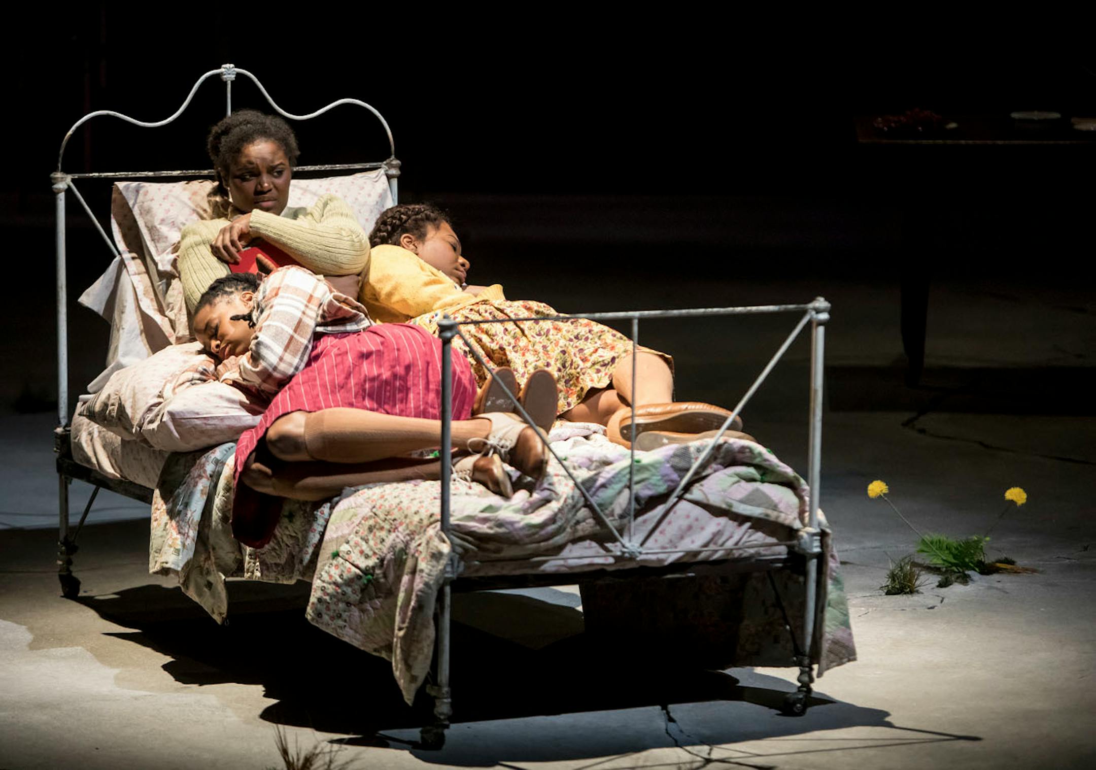 Carla Duren (Claudia), Brittany Bellizeare (Pecola) and Deonna Bouye (Frieda) in the Guthrie Theater's production of Toni Morrison's The Bluest Eye, adapted by Lydia R. Diamond and directed by Lileana Blain-Cruz.