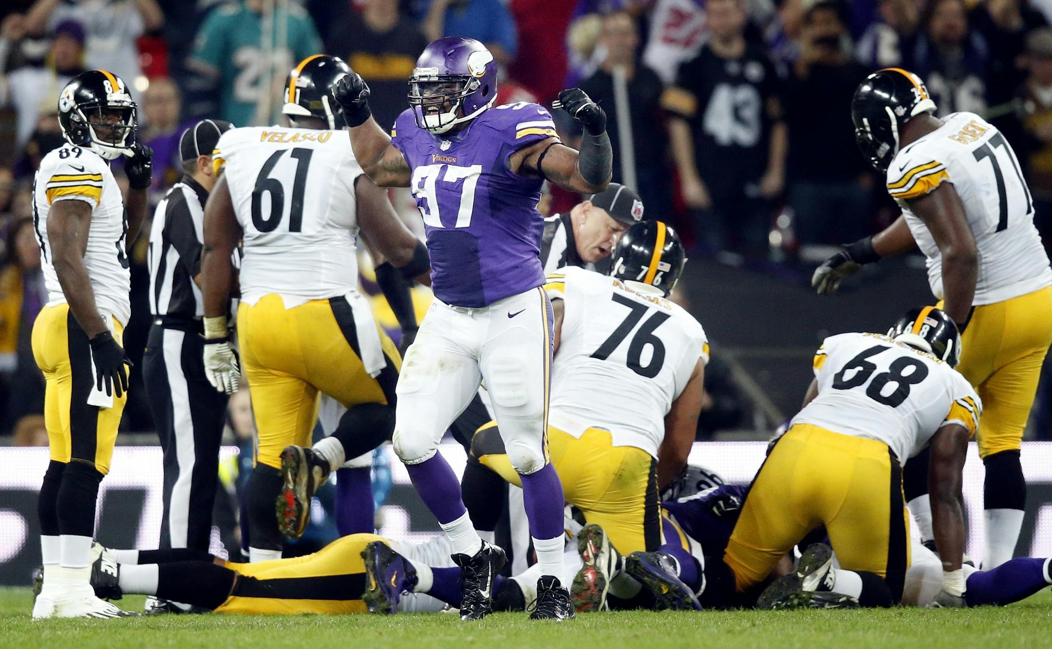 Everson Griffin (97) celebrated after a sack and forced fumble.Pittsburgh quarterback Ben Roethlisberger (7) was sacked and forced to fumble by Everson Griffin (97) in the final minute of the game.