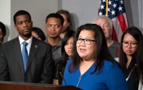 DFL Rep. Kaohly Her, seen at a 2018 news conference with Mayor Melvin Carter, said both her jobs are to advocate for St. Paul constituents.