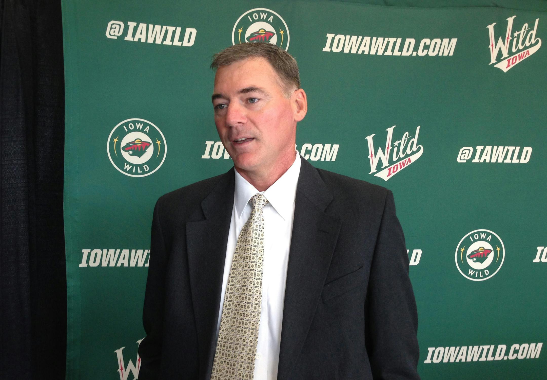 Kurt Kleinendorst talked to reporters after he was formally introduced as the first head coach of the Iowa Wild on Monday in Des Moines. He is a native of Grand Rapids, Minn.