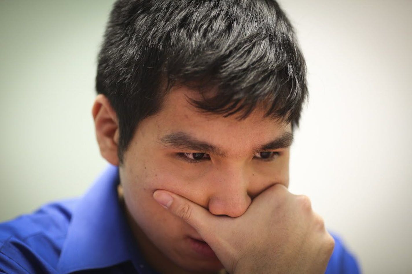 Chess Grandmaster Wesley So concentrated as he played chess with Sean Nagle at the Ridgedale Public Library on Friday, February 27, 2015 in Minnetonka, Minn.