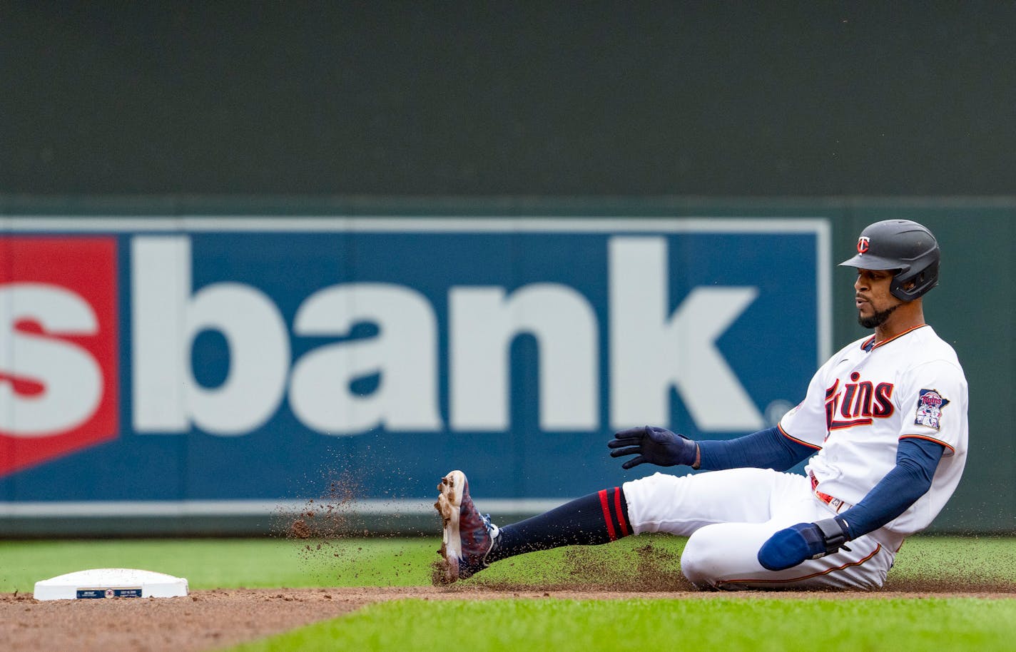 Minnesota Twins designated hitter Byron Buxton (25) slides into second base on a single by right fielder Max Kepler (26) in thew third inning against the Chicago White Sox Saturday, July 16, 2022 at Target Field in Minneapolis. ]