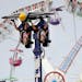 Riders are inverted on the Air Race on the Midway during the first day of the Minnesota State Fair Thursday, Aug. 25, 2016, in Falcon Heights, MN.