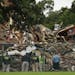 NTSB officials and Minneapolis police view the rubble at Minnehaha Academy.
