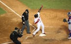 Boston Red Sox player Eduardo Nunez crosses home plate after hitting a three-run homer that broke Game 1 open in the seventh inning of the World Serie