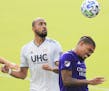 Orlando City's Junior Urso, left, headed the ball past New England forward Teal Bunbury, who grew up in Prior Lake, in their Eastern Conference semifi