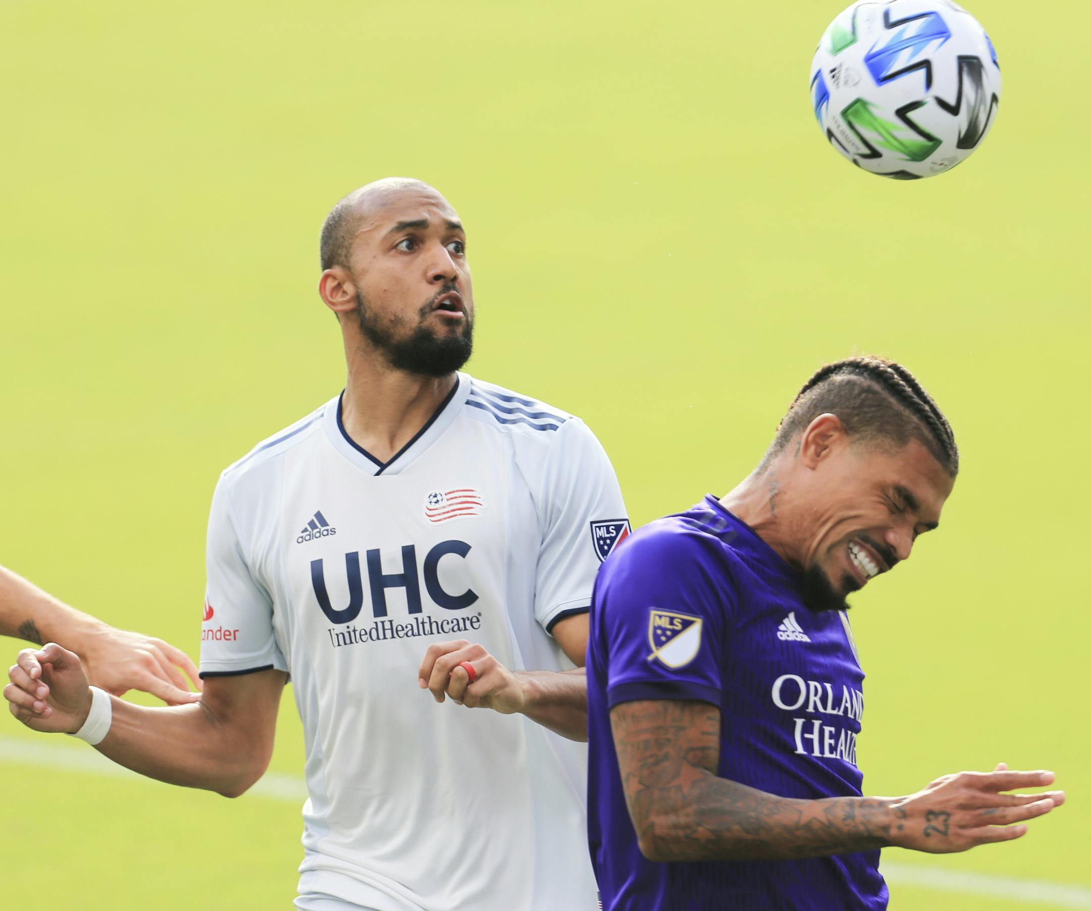 Orlando City's Junior Urso, left, headed the ball past New England forward Teal Bunbury, who grew up in Prior Lake, in their Eastern Conference semifinal.