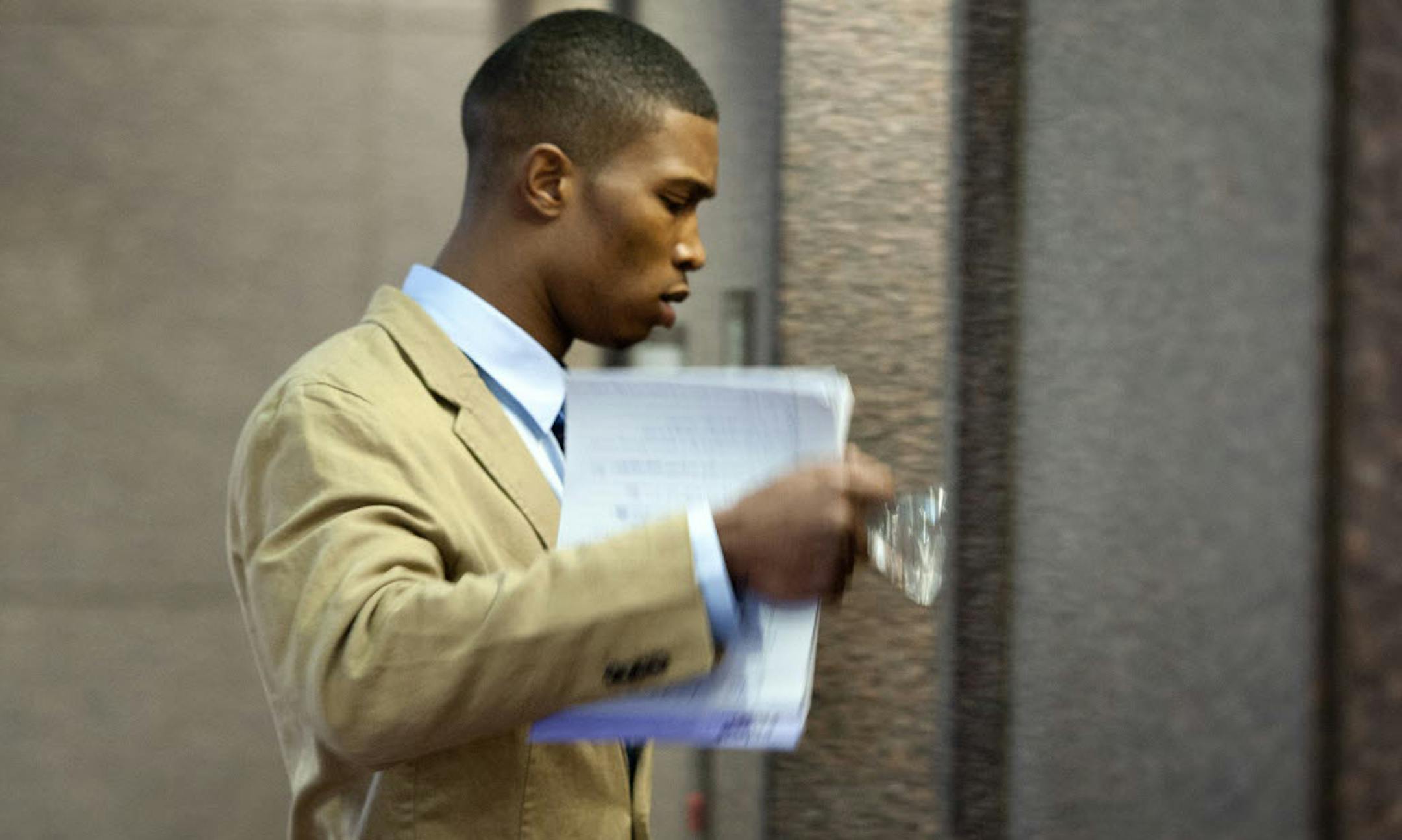 Minnesota Vikings cornerback Chris Cook walked toward an elevator after court Thursday.