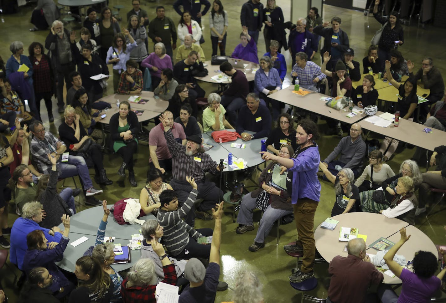 Aaron Spading, 2nd Precinct chair, was running a caucus for his first time. He asked for a show of hands of those in attendance who were interested in attending the city convention in July. ] JEFF WHEELER &#xef; jeff.wheeler@startribune.com Minneapolis DFLers caucused for City Council, Park Board and mayoral races in Ward 9 at South High School and elsewhere around the city Tuesday evening, April 4, 2017. So many people attended the Precinct 2 caucus that they had to move the caucus from a class