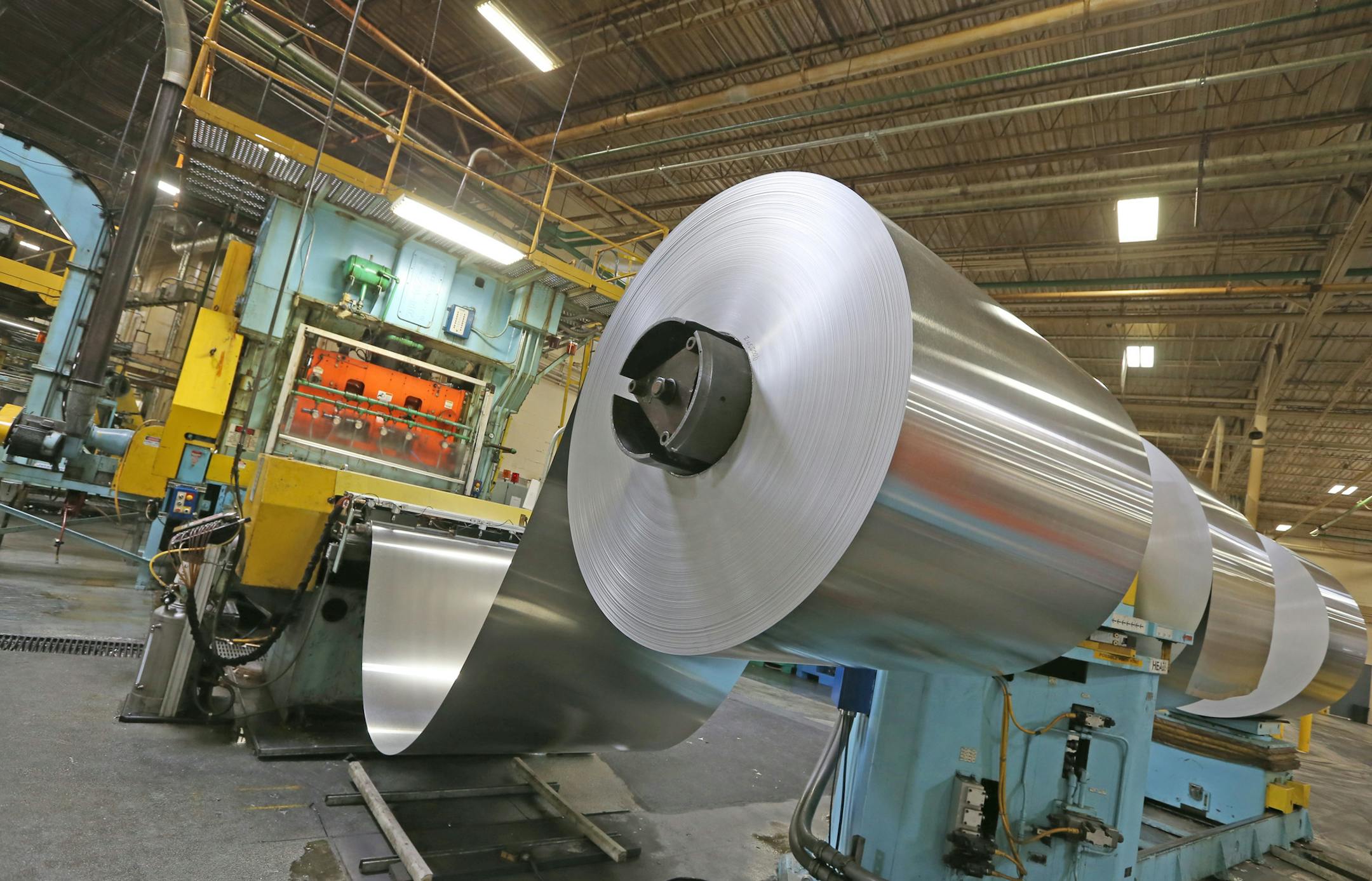 Giant rolls of Aluminum coil stock are fed into machines for the first step of making aluminum cans at the Rexam Plant in St. Paul. The coils weigh around 23,000 pounds each. Minnesotans only recycle 40% of all beer and soda cans. The nation recycles 58% of all cans. Yet the metal is easily recycled and increasingly going into cars and other items. Rexam Beverage Can Co. in St. Paul makes cans for Coke and Pepsi, etc and just made 1,200 cans for the state fair recycling exhibit. About 68% of Rex