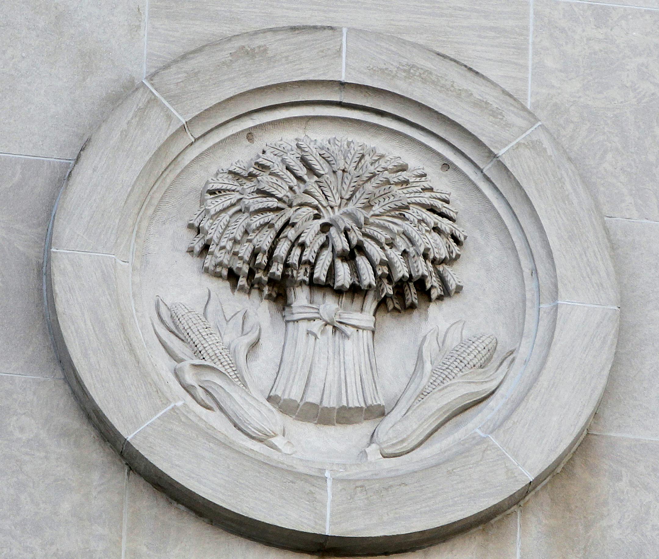 Construction crew from Ryan were beginning the process of removing medallions from front of Star Tribune building, Monday, February 10, 2014 in Minneapolis, MN. ] (ELIZABETH FLORES/STAR TRIBUNE) ELIZABETH FLORES • eflores@startribune.com