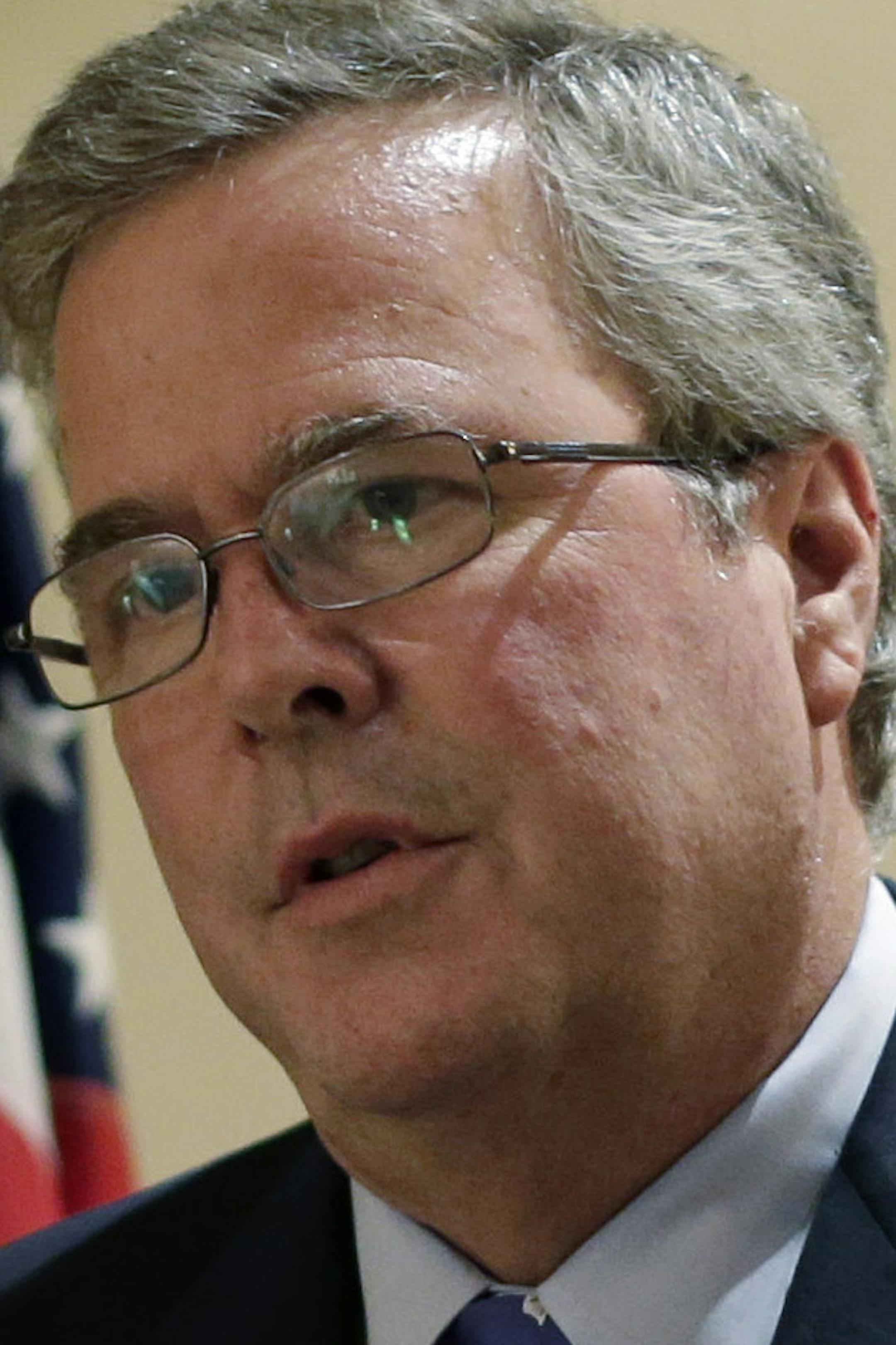 FILE - In this Feb. 26, 2013, file photo, former Florida Gov. Jeb Bush talks with the media following his address on education to the Texas Business Leadership Council in Austin, Texas. Bush writes in a new book that the nation needs to completely overhaul its immigration policies but cautions against providing a pathway to citizenship for illegal immigrants, a position that puts him at odds with some Senate reformers within his own party. (AP Photo/Eric Gay, File)