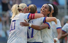 Sam Coffey (17) celebrates her first-half goal with United States teammates Lindsey Heaps (10) and Naomi Girma during Saturday's exhibition against Ch