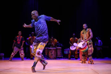 Youssouf Koumbassa dances to drum beats by Fode Bangoura in “Reunion” at the Fakoly conference.