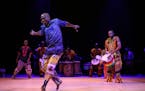 Youssouf Koumbassa dances to drum beats by Fode Bangoura in “Reunion” at the Fakoly conference.